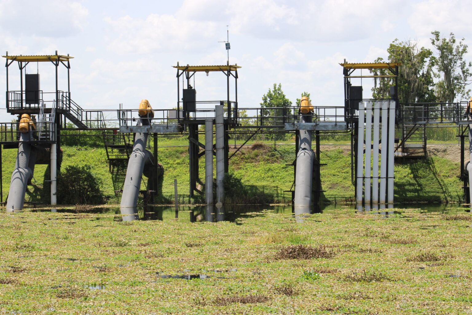 Irrigation pumping station with pumps and steel access platforms in a field