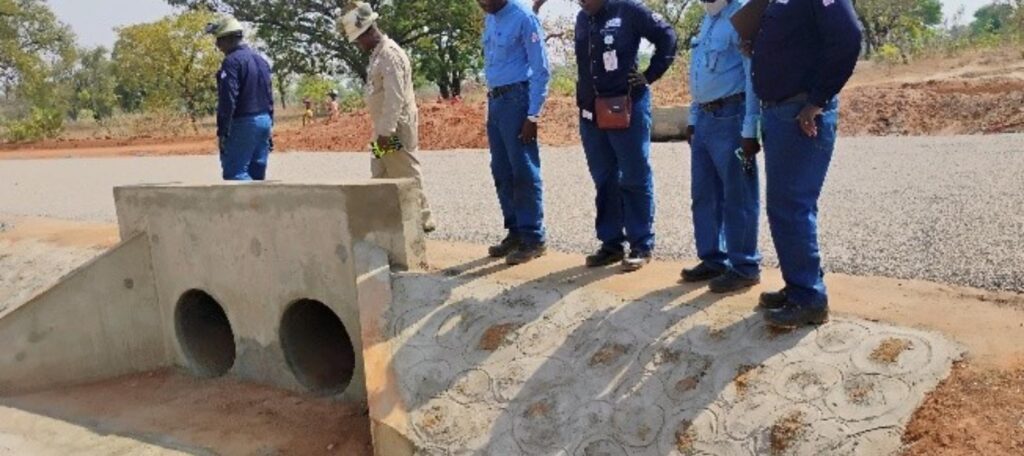 Completed twin-cell reinforced concrete culvert headwall with stone-pitched apron near Madjo, Chad